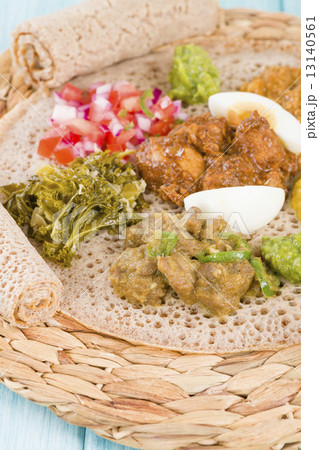 Ethiopian Feast - Injera with doro wat, yebeg alicha, misir wat, kik alicha, and gomen Ethiopian Feast - Injera with doro wat, yebeg alicha, misir wat, kik alicha, and gomen 13140561