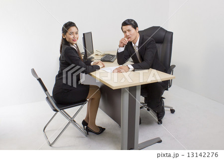 Man and woman seated at the table 13142276