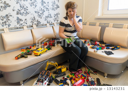 Mom and Children toys on floor in the room Mom and Children toys on floor in the room 13143231