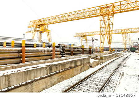 overhead cranes over railroad in outdoor warehouse 13143957
