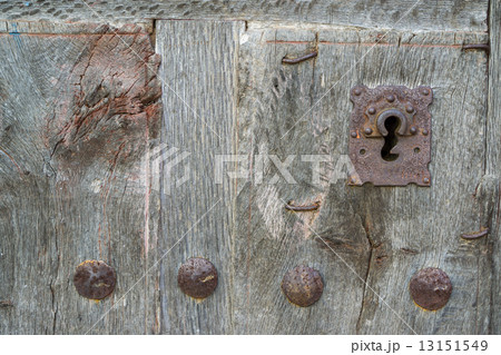 Old run-down wooden door and iron lock 13151549