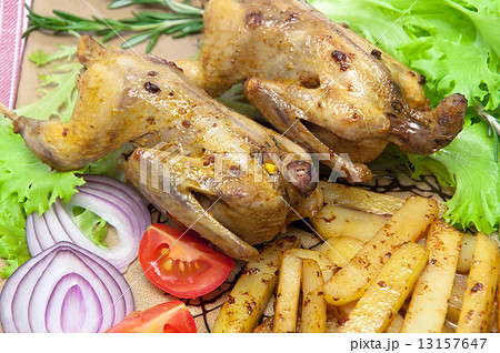 roasted carcass woodcock with potatoes and vegetables on a plate 13157647