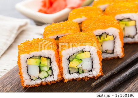 Sushi roll with tobico and avocado Sushi roll with tobico and avocado 13160196