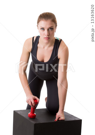 Confident female athlete posing looking at camera 13163620