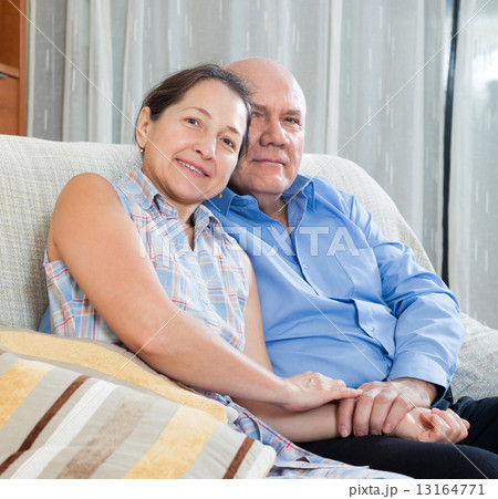 Happy couple grandparents in the house 13164771