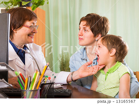 Doctor examining child Doctor examining child 13165567