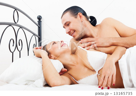Loving adult couple awaking together 13165735