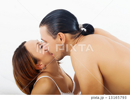 Loving couple kissing in bed 13165793