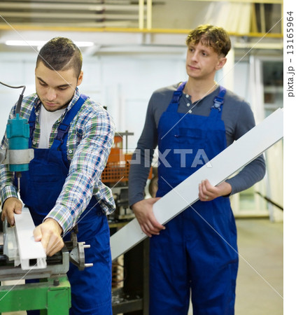 Couple of workmen at factory Couple of workmen at factory 13165964