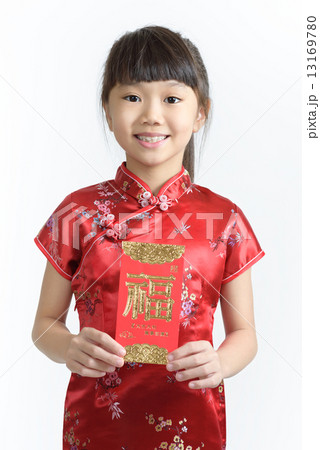 One young chinese girl in cheongsam holding a red packet in isolated white background One young chinese girl in cheongsam holding a red packet in isolated white background 13169780