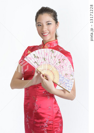 One young chinese woman in Cheongsam with Chinese Fan in isolated white background 13171228