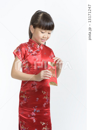 1 young chinese girl in cheongsam opening her lunar new year red packet isolated white background 1 young chinese girl in cheongsam opening her lunar new year red packet isolated white background 13171247