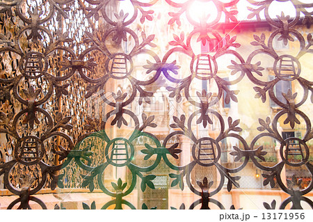 The rays of sun through forged lattice fence Scaliger Tombs in The rays of sun through forged lattice fence Scaliger Tombs in 13171956