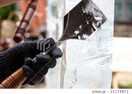 Ice Carver Using Chisel to Carve  Ice Carver Using Chisel to Carve  13174872