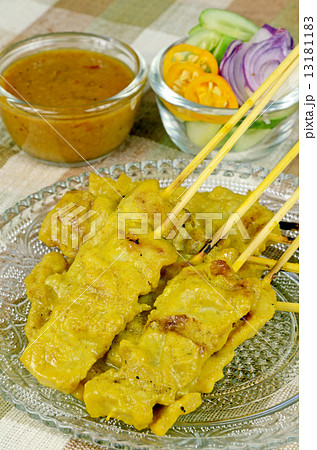 Indonesian Satay with peanut sauce and pickled vegetable. Indonesian Satay with peanut sauce and pickled vegetable. 13181183