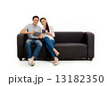 Asian Couple on Couch in White Background Asian Couple on Couch in White Background 13182350