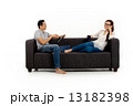 Asian Couple on Couch in White Background Asian Couple on Couch in White Background 13182398