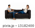 Asian Couple on Couch in White Background Asian Couple on Couch in White Background 13182400