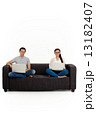 Asian Couple on Couch in White Background Asian Couple on Couch in White Background 13182407