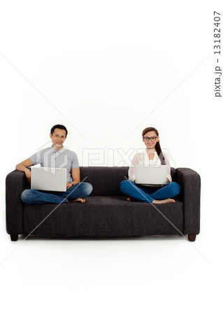 Asian Couple on Couch in White Background 13182407