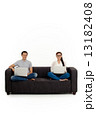 Asian Couple on Couch in White Background Asian Couple on Couch in White Background 13182408