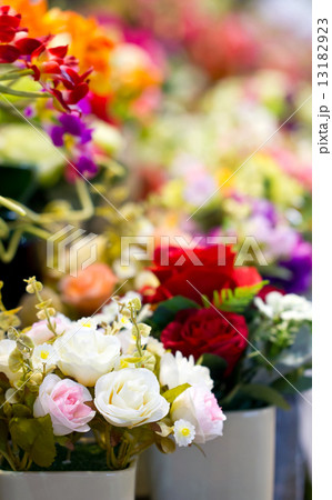 Close up of colorful artificial flowers. 13182923