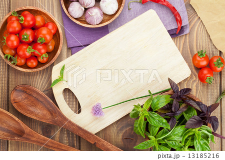 Fresh farmers tomatoes and basil on wood table Fresh farmers tomatoes and basil on wood table 13185216