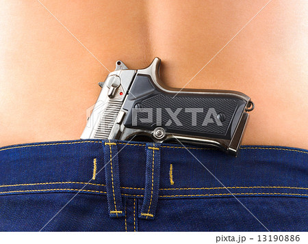 Woman in jeans and gun Woman in jeans and gun 13190886