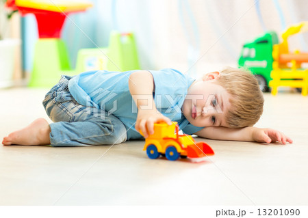 child boy toddler playing with toy car child boy toddler playing with toy car 13201090