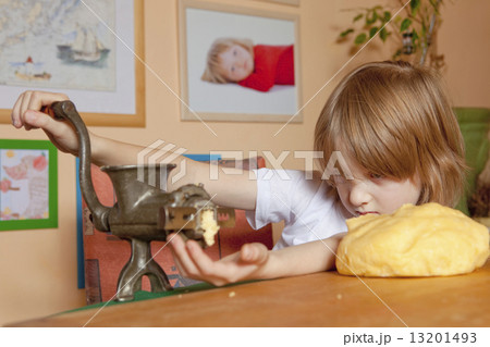 Boy Grinding Flour 13201493