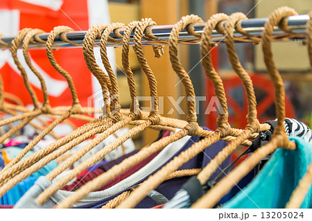 Clothing on hangers at a night market store 13205024