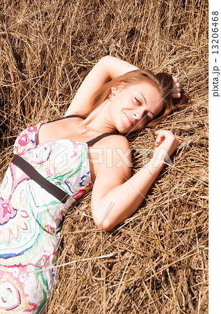 Young beautiful woman on hay Young beautiful woman on hay 13206468