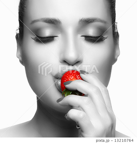 Beautiful Young Woman Eating Strawberry 13210764