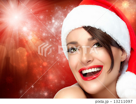 Merry Christmas. Beauty Girl in Santa Hat. Beautiful Big Smile 13211097