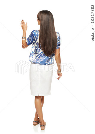 Business woman in pointing at copy space 13217882