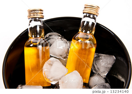 two bottles of rum with ice cube in shape like crystal of diamonds two bottles of rum with ice cube in shape like crystal of diamonds 13234140