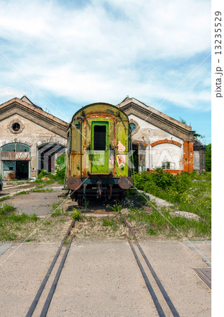Wrecked train at old depot 13235529