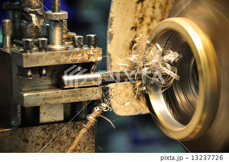 lathe machine in a workshop, Part of the lathe. Lathe machine is operation on the work shop. lathe machine in a workshop, Part of the lathe. Lathe machine is operation on the work shop. 13237726