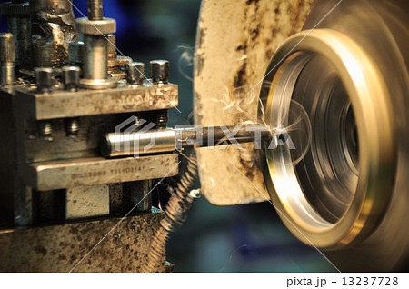 lathe machine in a workshop, Part of the lathe. Lathe machine is operation on the work shop. lathe machine in a workshop, Part of the lathe. Lathe machine is operation on the work shop. 13237728