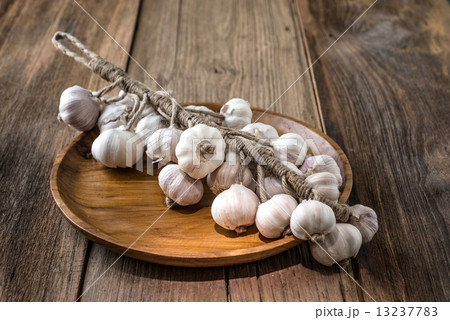 Bunch of dried garlic bulbs on a wooden Tray 13237783