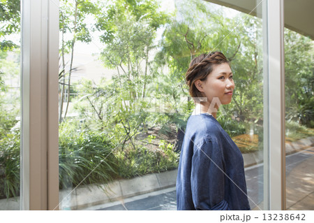 A woman on a walkway in Namba Park office and shopping complex. 13238642
