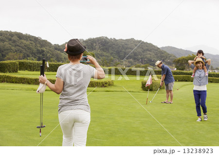 Family on a golf course. Family on a golf course. 13238923
