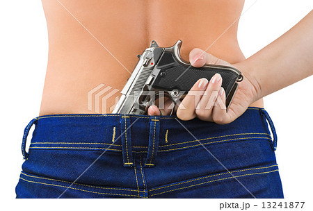 Woman in jeans and gun 13241877