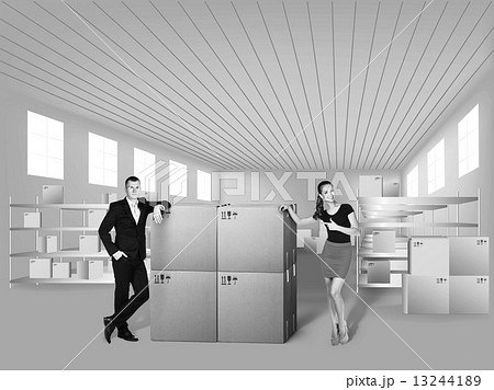 Young woman and man in warehouse 13244189