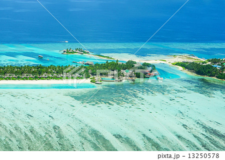 Tropical island on Bora Bora with water villas and coral reef. Tropical island on Bora Bora with water villas and coral reef. 13250578