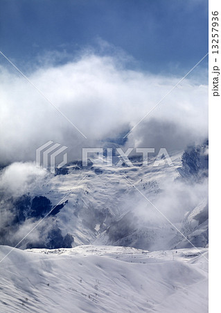 Off-piste slope in fog 13257936