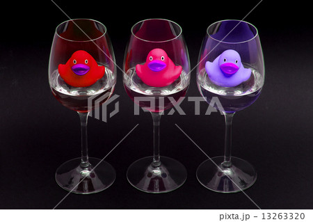 Red, pink and purple rubber ducks in wineglasses Red, pink and purple rubber ducks in wineglasses 13263320