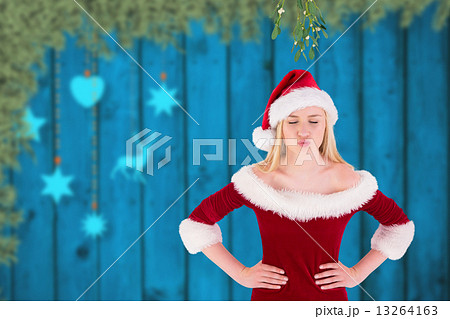 Composite image of festive cute blonde under mistletoe 13264163