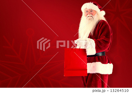 Composite image of santa carries red gift bag Composite image of santa carries red gift bag 13264510