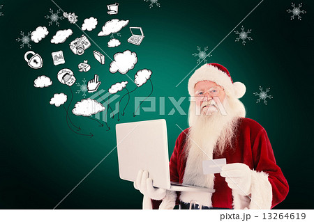Composite image of santa pays with credit card on a laptop Composite image of santa pays with credit card on a laptop 13264619